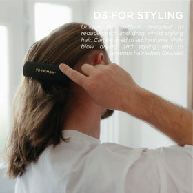 Denman D3 held in hand to show size and balance for effortless styling