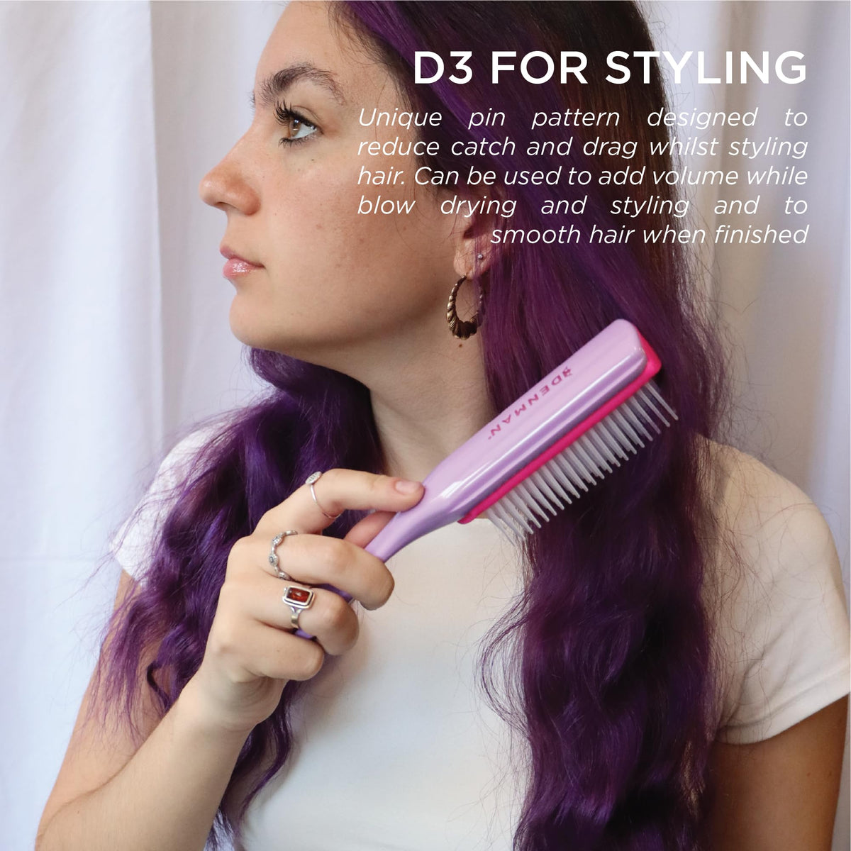 Denman D3 used while blow-drying curls to create defined, ribbon-like shape