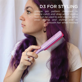 Denman D3 used while blow-drying curls to create defined, ribbon-like shape