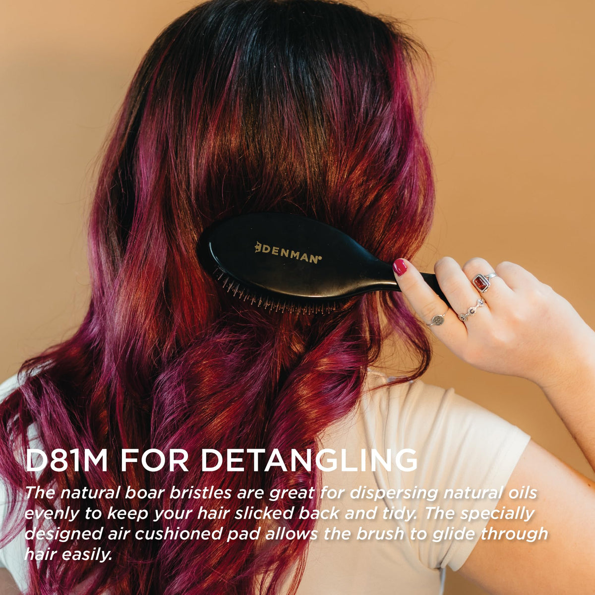 Denman detangling curly hair with gentle nylon pins to reduce breakage