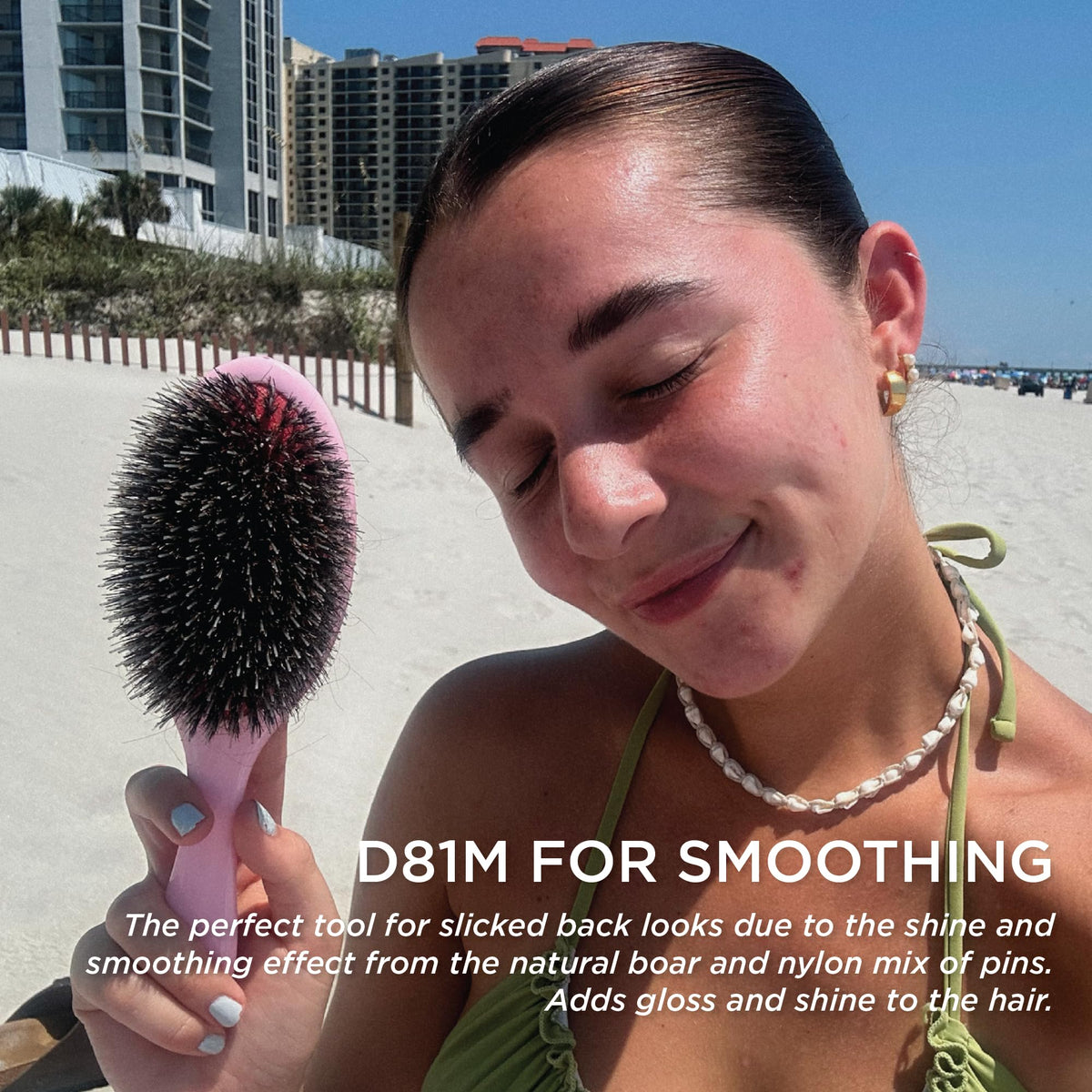 Denman brush used on scalp demonstrating gentle massage that stimulates circulation and shine