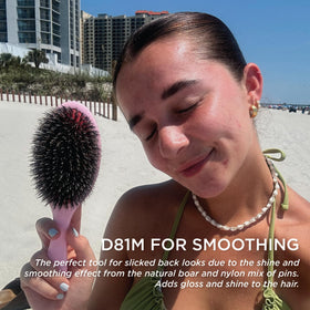 Denman brush used on scalp demonstrating gentle massage that stimulates circulation and shine
