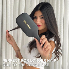 Denman detangling wet hair gently to reduce pulling and knots