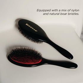Denman brushing a wig and extensions, protecting fibers and adding gloss