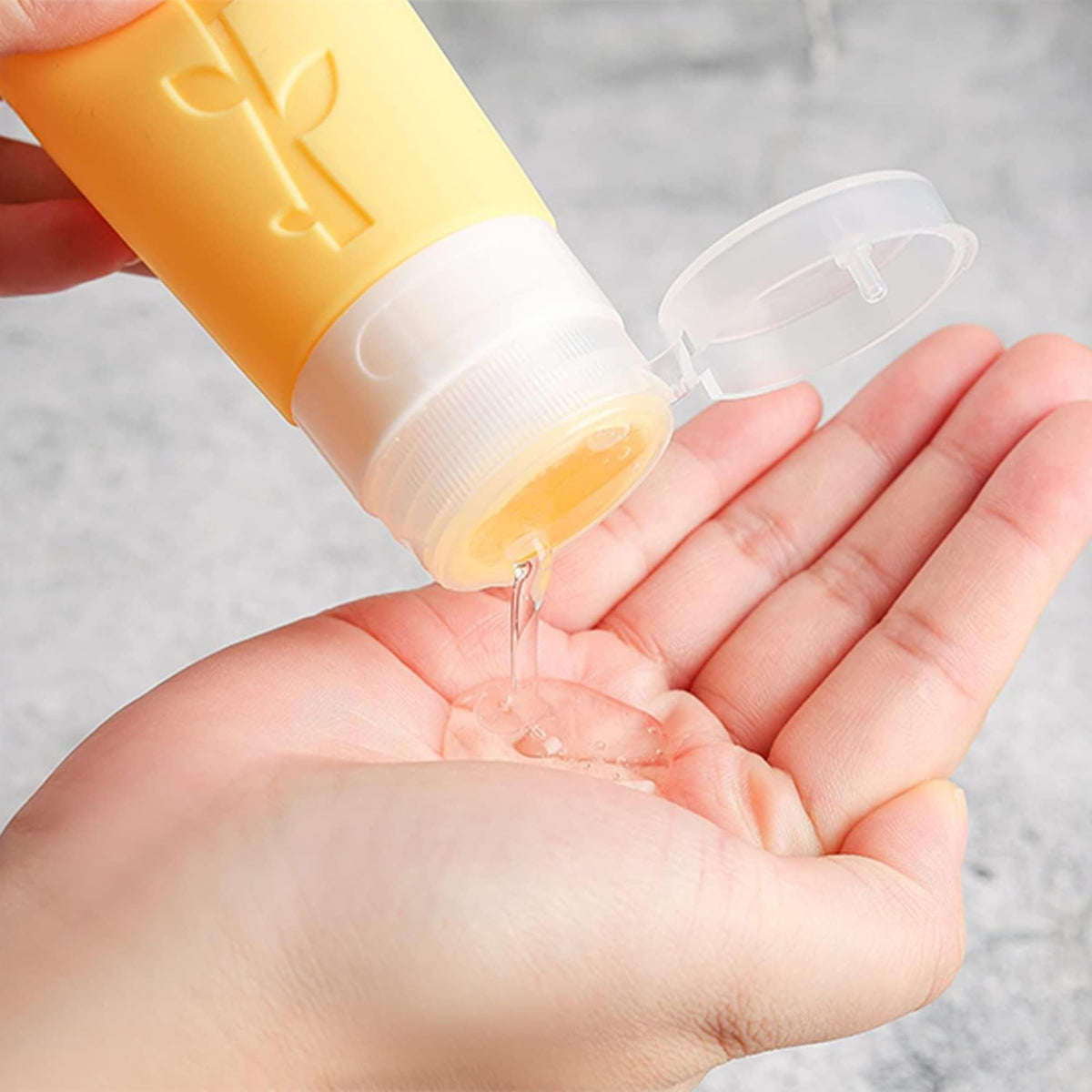 DEPOZA bottles next to a coin showing compact travel-friendly scale