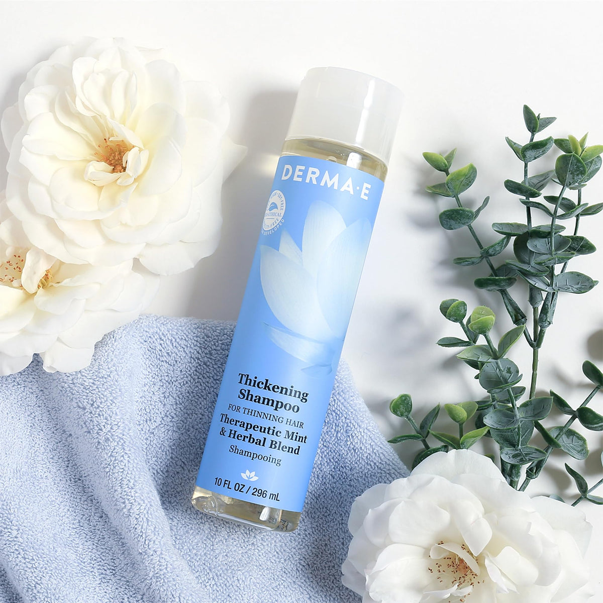 Derma E bottle on bathroom shelf showing everyday hair care benefit
