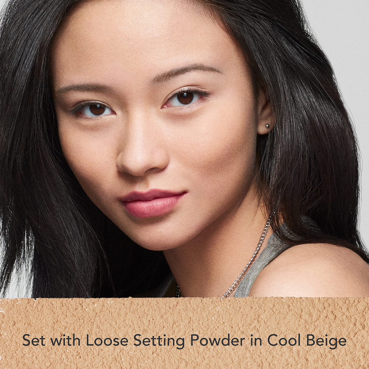 Dermablend powder being picked up with brush for seamless mattifying application benefit