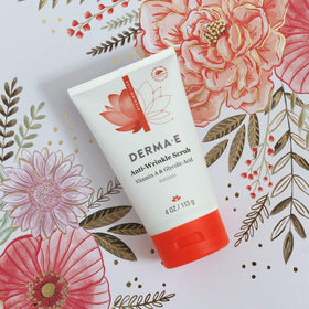 DERMA E jar held in hand demonstrating size and travel-friendly benefit