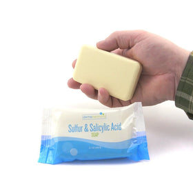 Dermaharmony bar in hand scale view illustrating compact 3.7 oz size and easy use