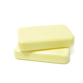 DermaHarmony bar placed next to a ruler showing 3.7 oz size for scale