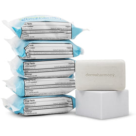 Dermaharmony bar held in hand showing size comparison and portability benefit