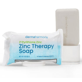 Dermaharmony lathered soap in hand showing creamy rinse and gentle cleanse