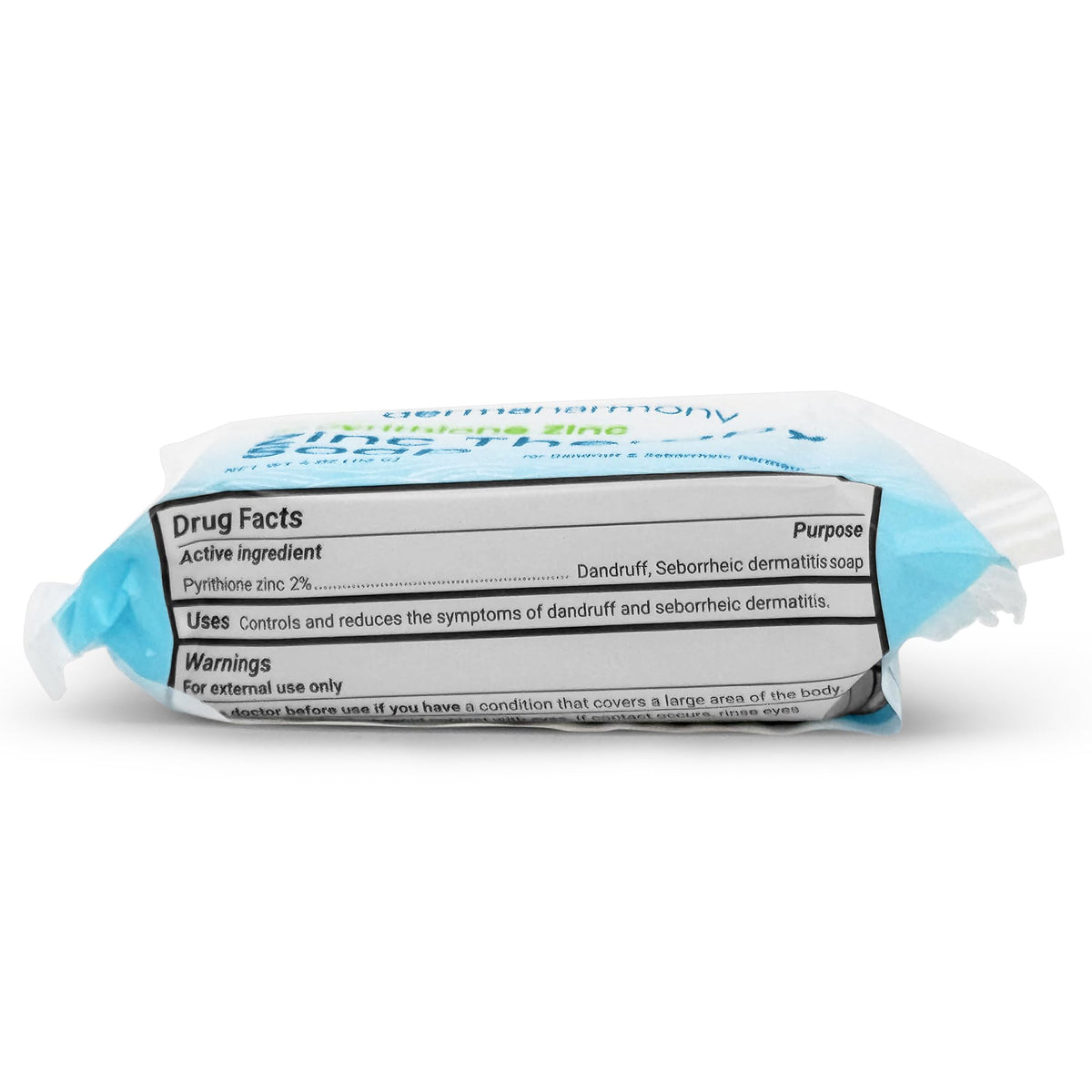 Dermaharmony bar beside coin showing compact 4 oz size and travel convenience