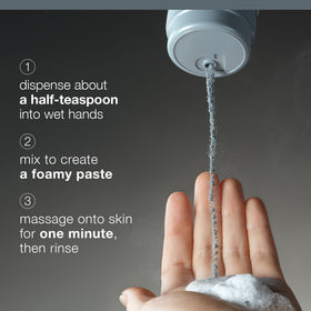 Hands mixing Dermalogica powder with water to create exfoliating paste