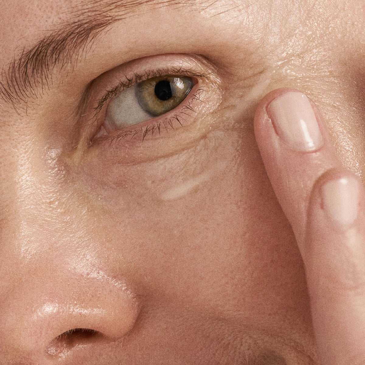 Dermalogica serum texture on fingertip showing lightweight absorbent feel