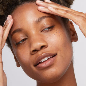 Dermalogica being applied outdoors to face showing wearable protection in sun