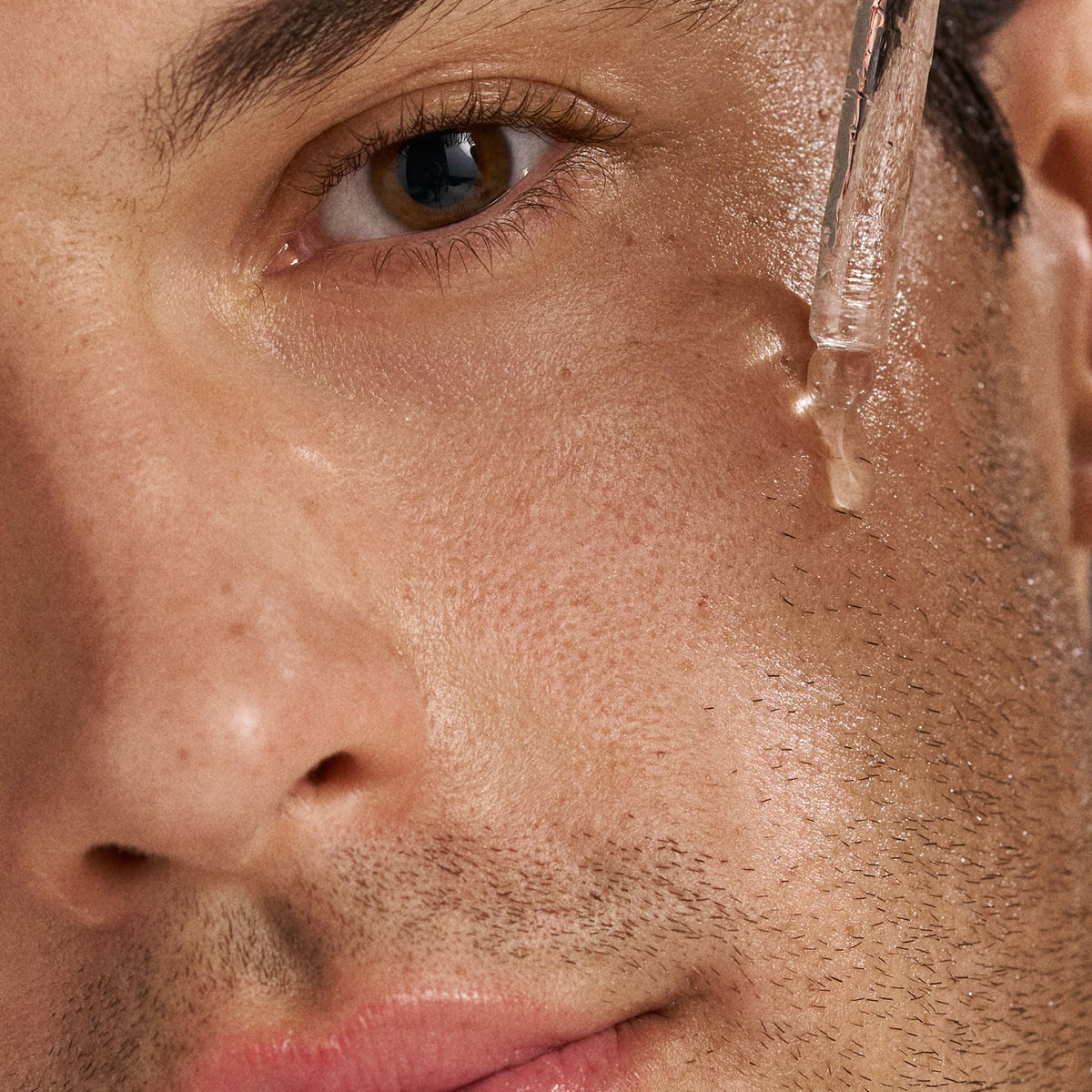 Dermalogica serum being applied to face demonstrating targeted blemish care