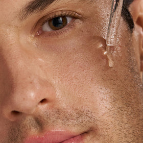 Dermalogica serum being applied to face demonstrating targeted blemish care