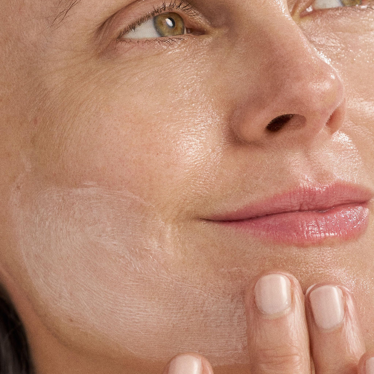 Dermalogica application on face and neck with fingers for barrier protection benefit