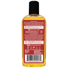 Jojoba seeds and Desert Essence bottle highlighting sustainable sourcing
