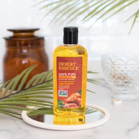 Scalp massage with Desert Essence jojoba oil improving scalp comfort
