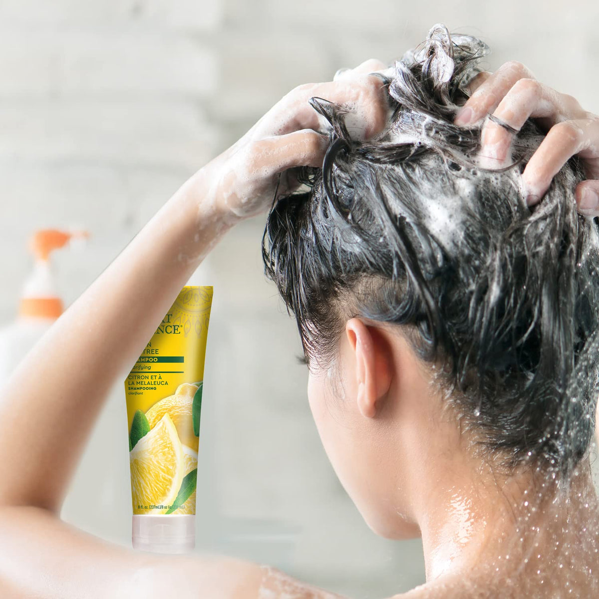 Desert Essence in shower with water droplets, demonstrates easy rinsing and clean feel