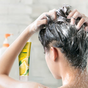 Desert Essence in shower with water droplets, demonstrates easy rinsing and clean feel