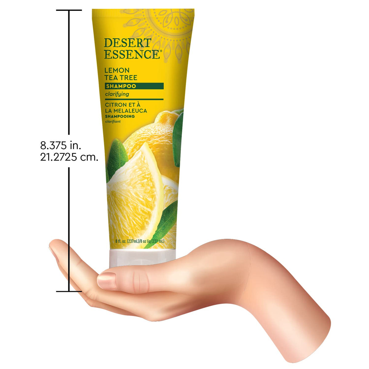 Desert Essence next to a ruler and personal items, shows true 8 ounce size