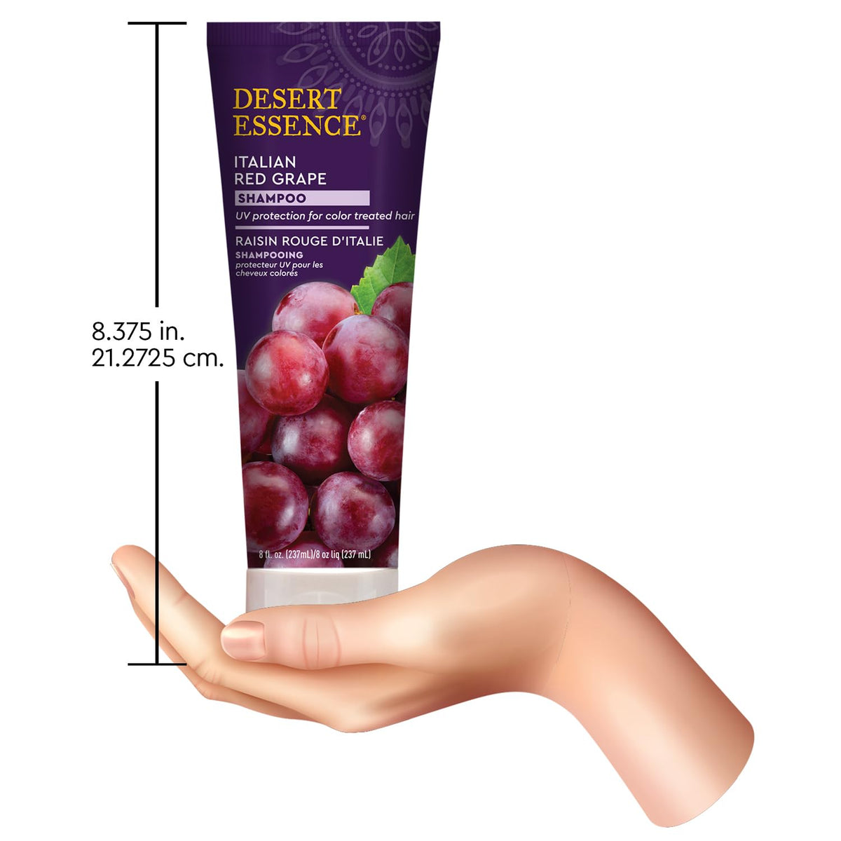 Desert Essence bottle held in hand to show 8 fl oz size and travel convenience