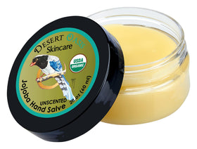 Desert Oasis Skincare applying salve to dry hands for deep conditioning