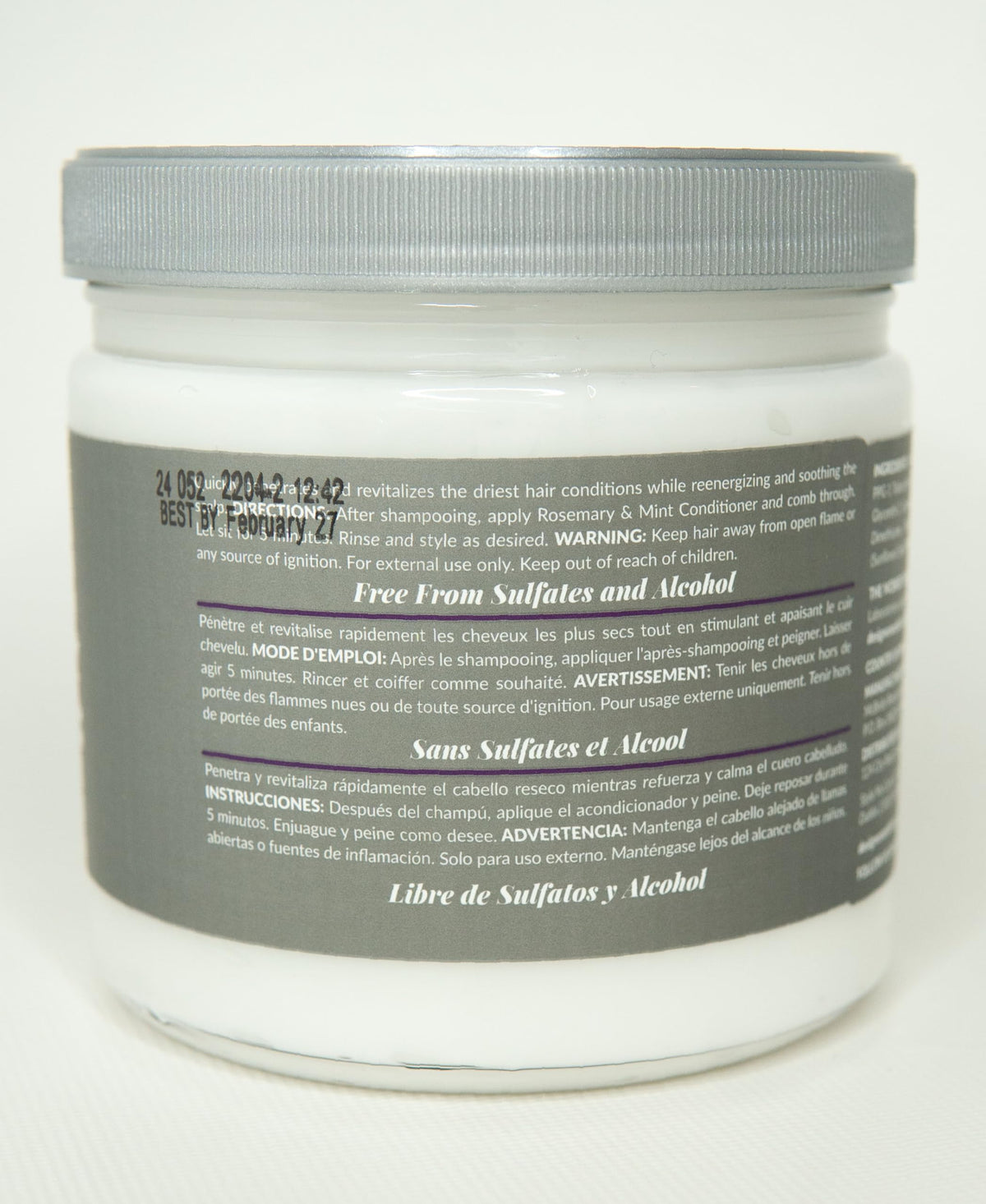 Design Essentials applying conditioner to wet hair for detangling benefit