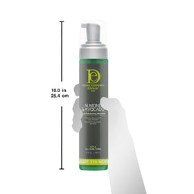 Design Essentials 10 oz bottle next to hand for accurate size