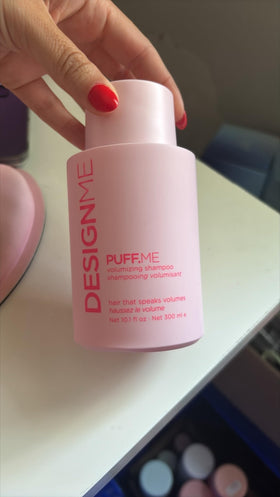 Close-up of Design.Me label with vegan, sulfate-free, color-safe claims