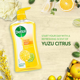 Dettol bottle beside travel items showing compatibility with shower kits