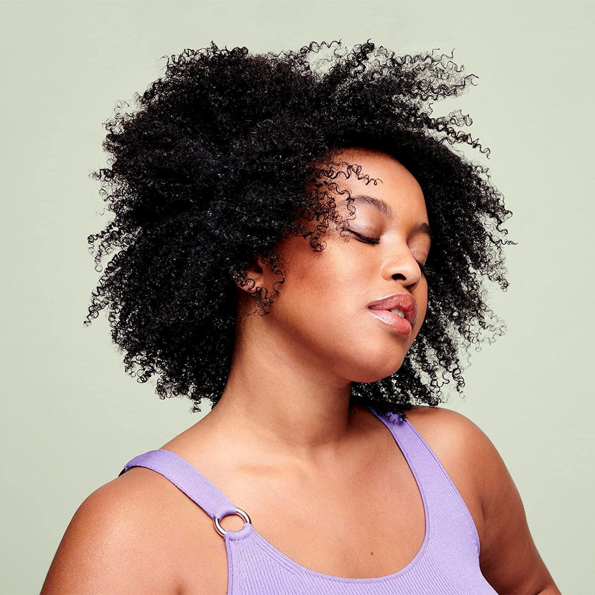 DevaCurl applied to wet curls for easier detangling and definition