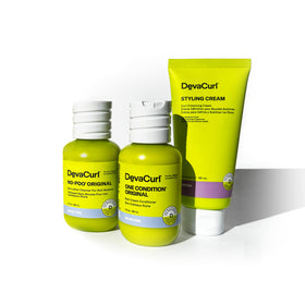 DevaCurl kit held in hand to show travel size and convenient on-the-go benefit