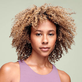 DevaCurl close-up of fine mist texture highlighting hydration delivery and non-greasy finish