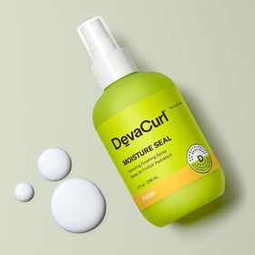 DevaCurl spray nozzle dispensing mist demonstrating even application and lightweight coverage