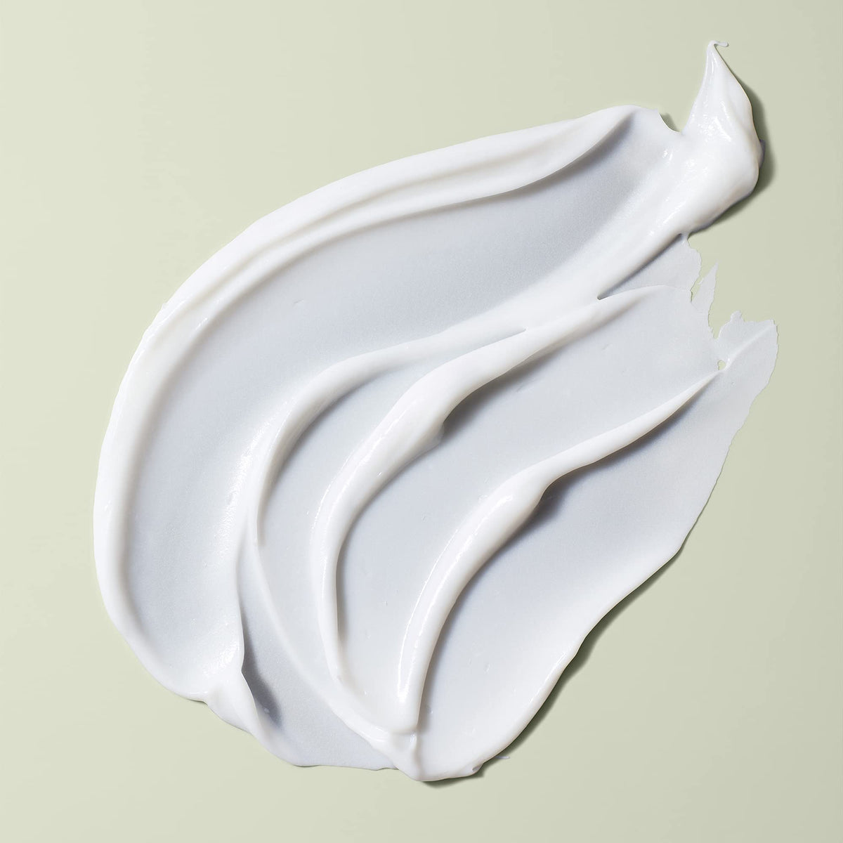 DevaCurl cream texture close-up highlighting rich moisture and smooth application