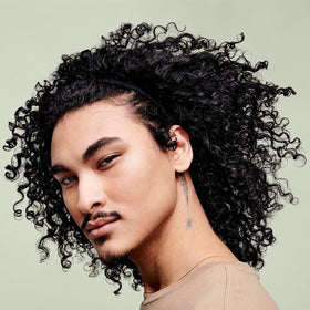 DevaCurl 7.6 fl oz size comparison showing travel-friendly volume