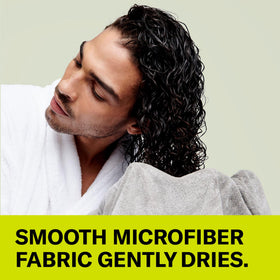 DevaCurl towel in use scrunching wet curls to preserve definition