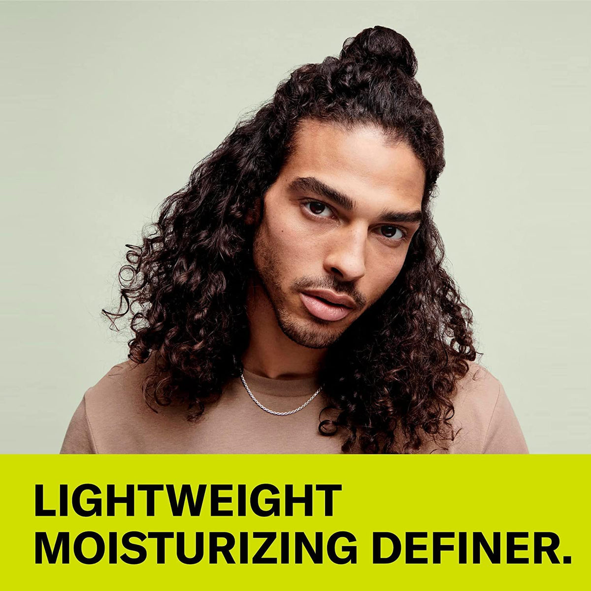 DevaCurl Wave Maker in hand for scale showing 5 fl oz compact convenience