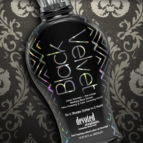 Devoted Creations bottle next to hand for scale, indicates travel-friendly 12.25 oz size