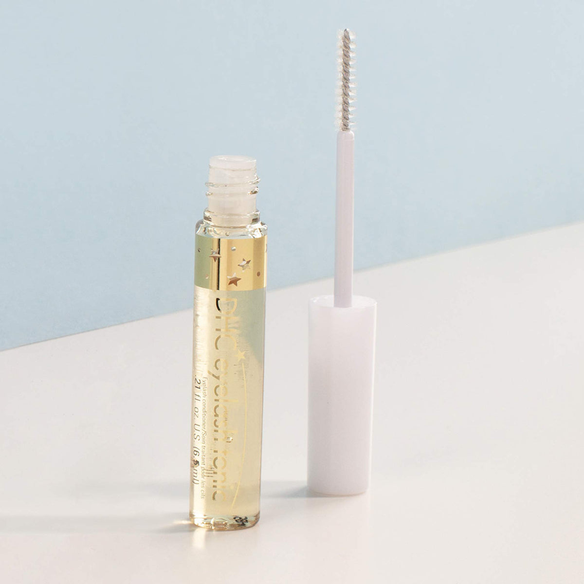 DHC eyelash tonic applied under mascara demonstrating daytime use