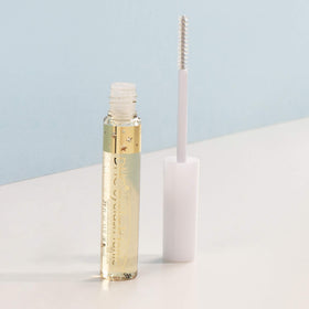 DHC eyelash tonic applied under mascara demonstrating daytime use