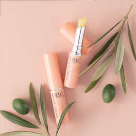 DHC lip cream cap open revealing smooth balm texture for easy glide