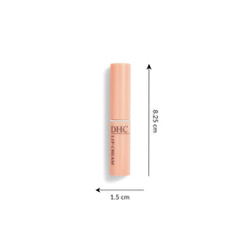 DHC lip cream held in hand to show size and portability for everyday use