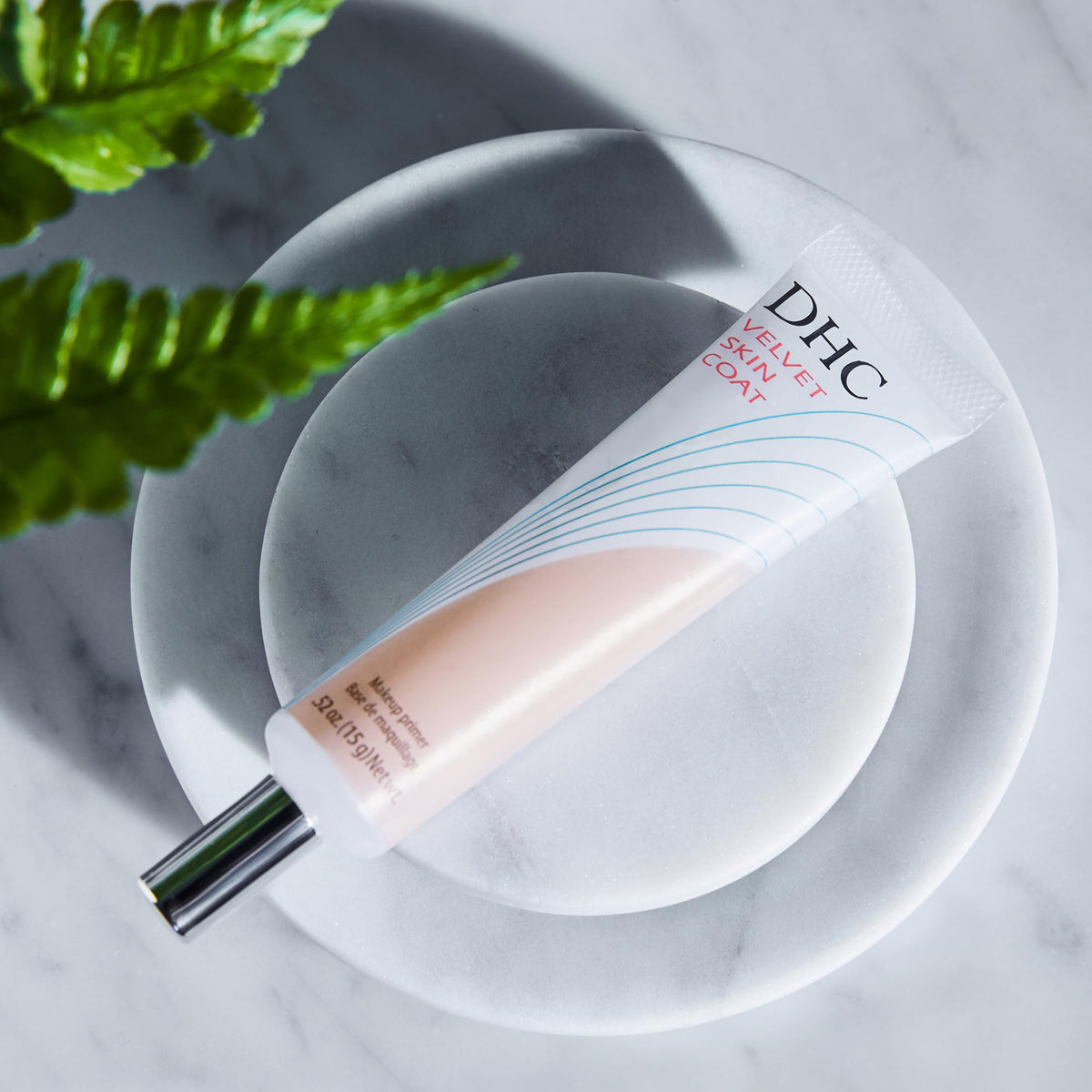 DHC primer with foundation brush and sponge, improves makeup longevity