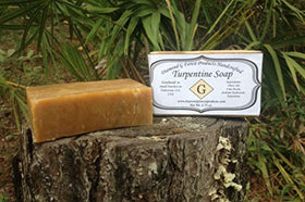 Diamond G Forest Products turpentine soap beside hunting gear showing scent-masking benefit