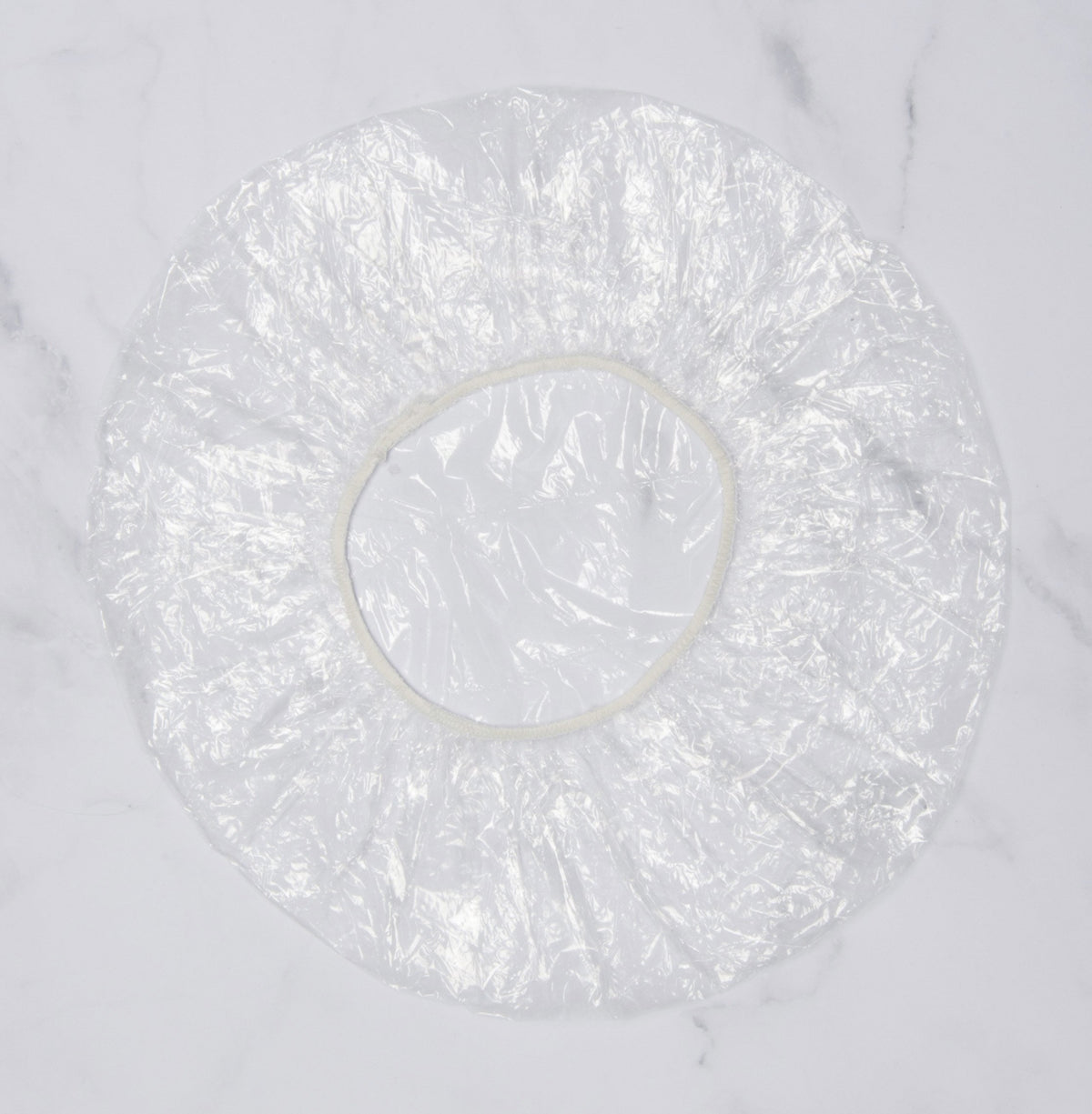 Diane cap stretched on head demonstrating extra-large fit and secure hold